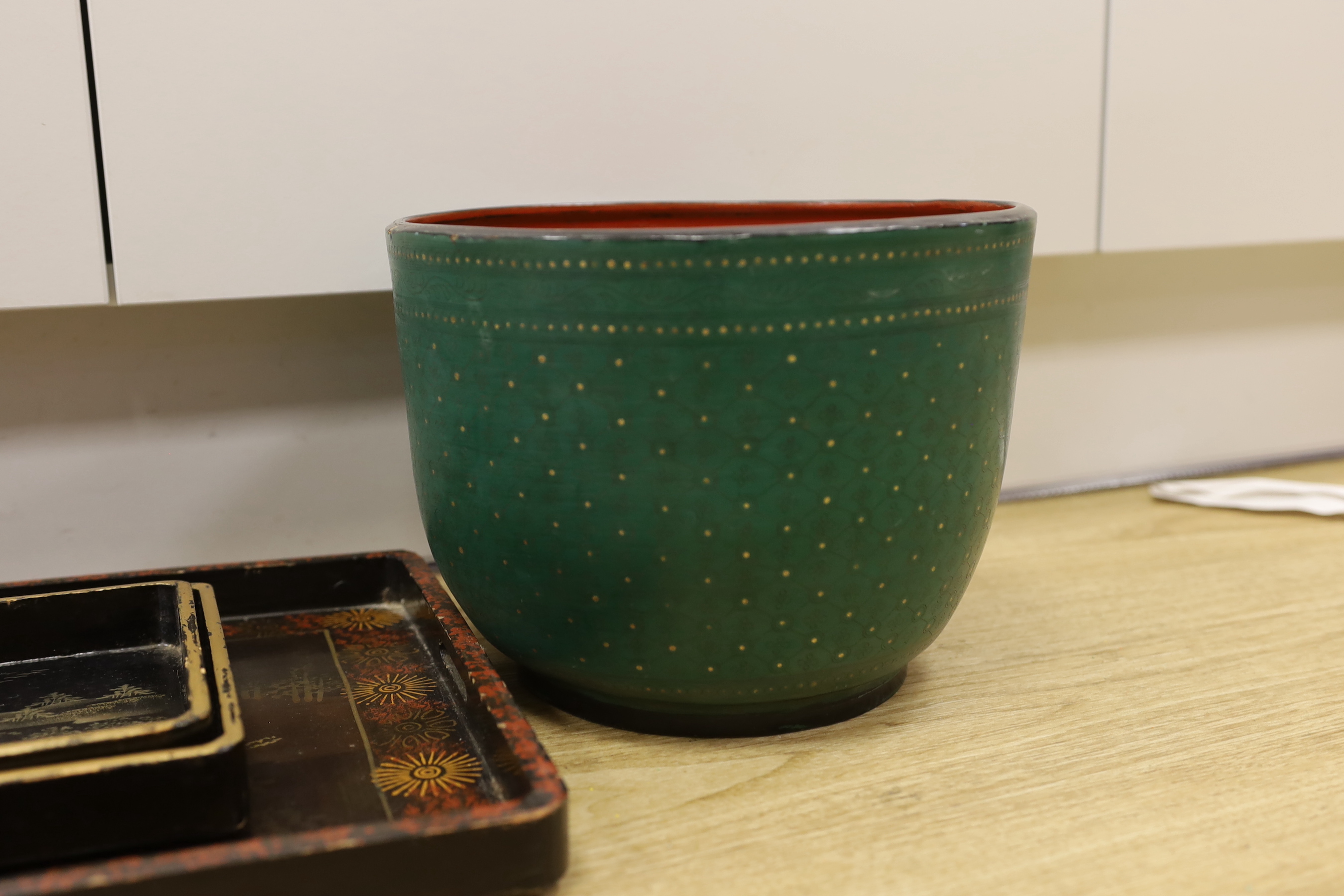 A Thai lacquer bowl and three Japanese lacquer rectangular trays, bowl 18.5cm high